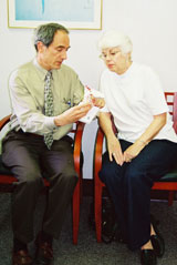 Dr. Evan Cantini with a patient