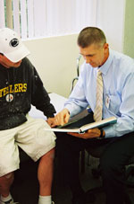 Dr. Chatilo with a patient
